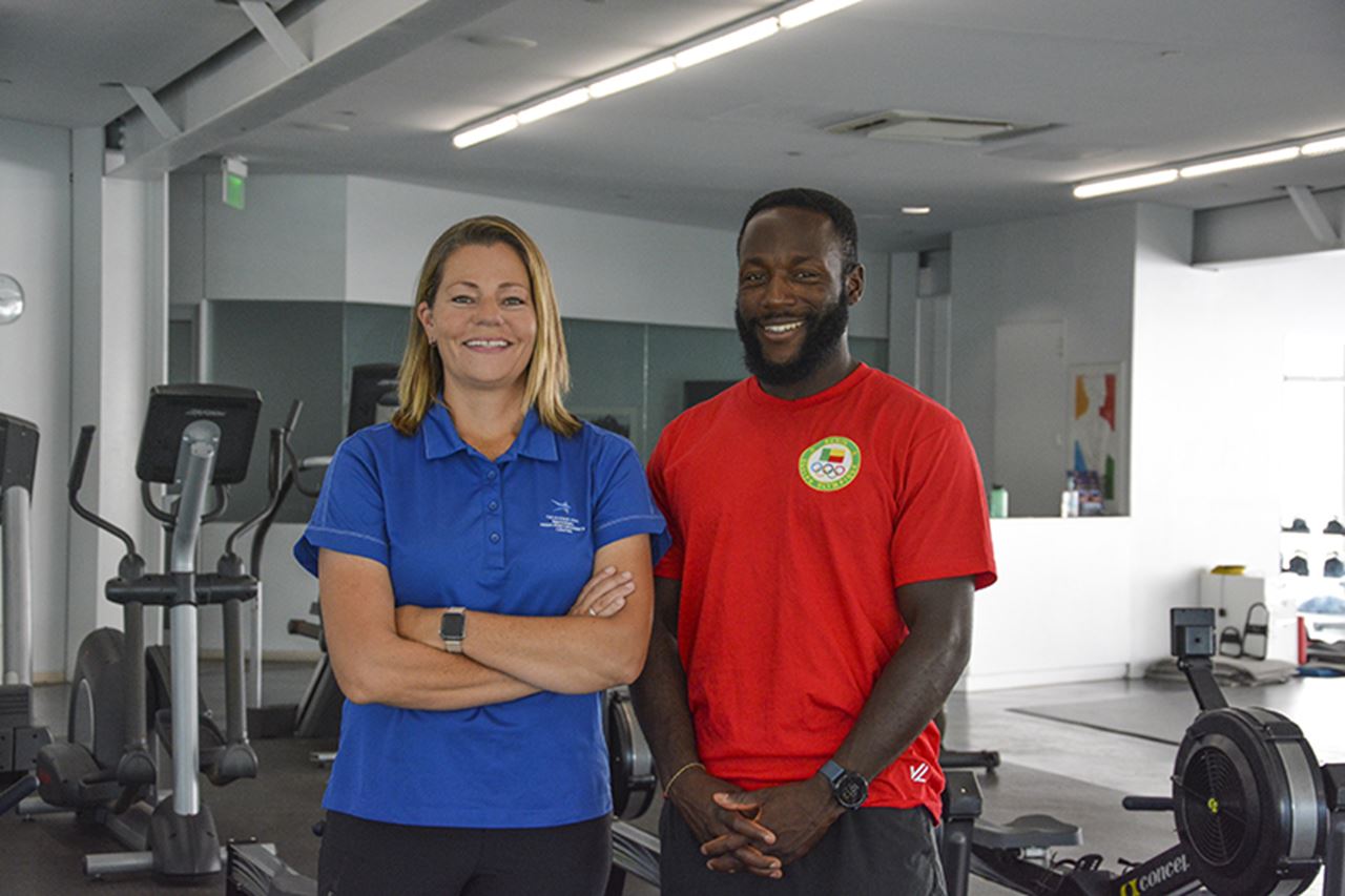 Reilly Dampeer '21, left, with Olympic rower Privel Hinkati. Photo courtesy of Reilly Dampeer.