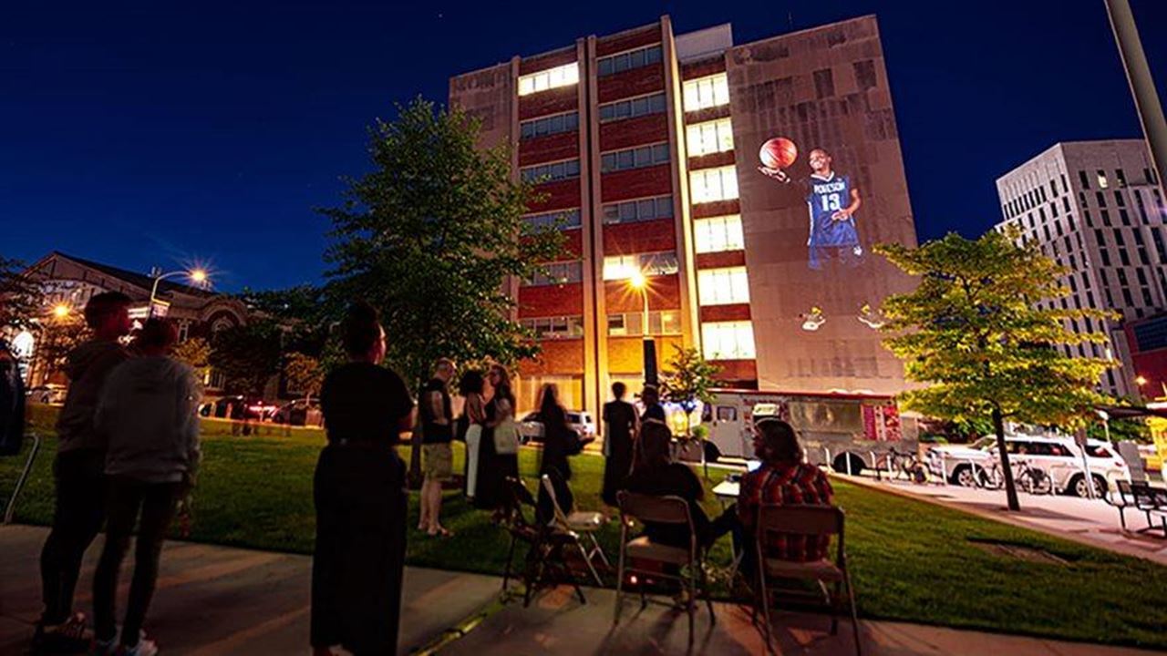 But We Keep Going, the Paul Robeson High School senior portrait series, was celebrated on the evening of June 17 with a projection event on Drexel's University City campus produced by Welsh, Writers Room Assistant Director Patrice Worthy, Pearlstein Gallery Exhibitions and Programs Coordinator Leah Appleton, and Greenhouse Media.