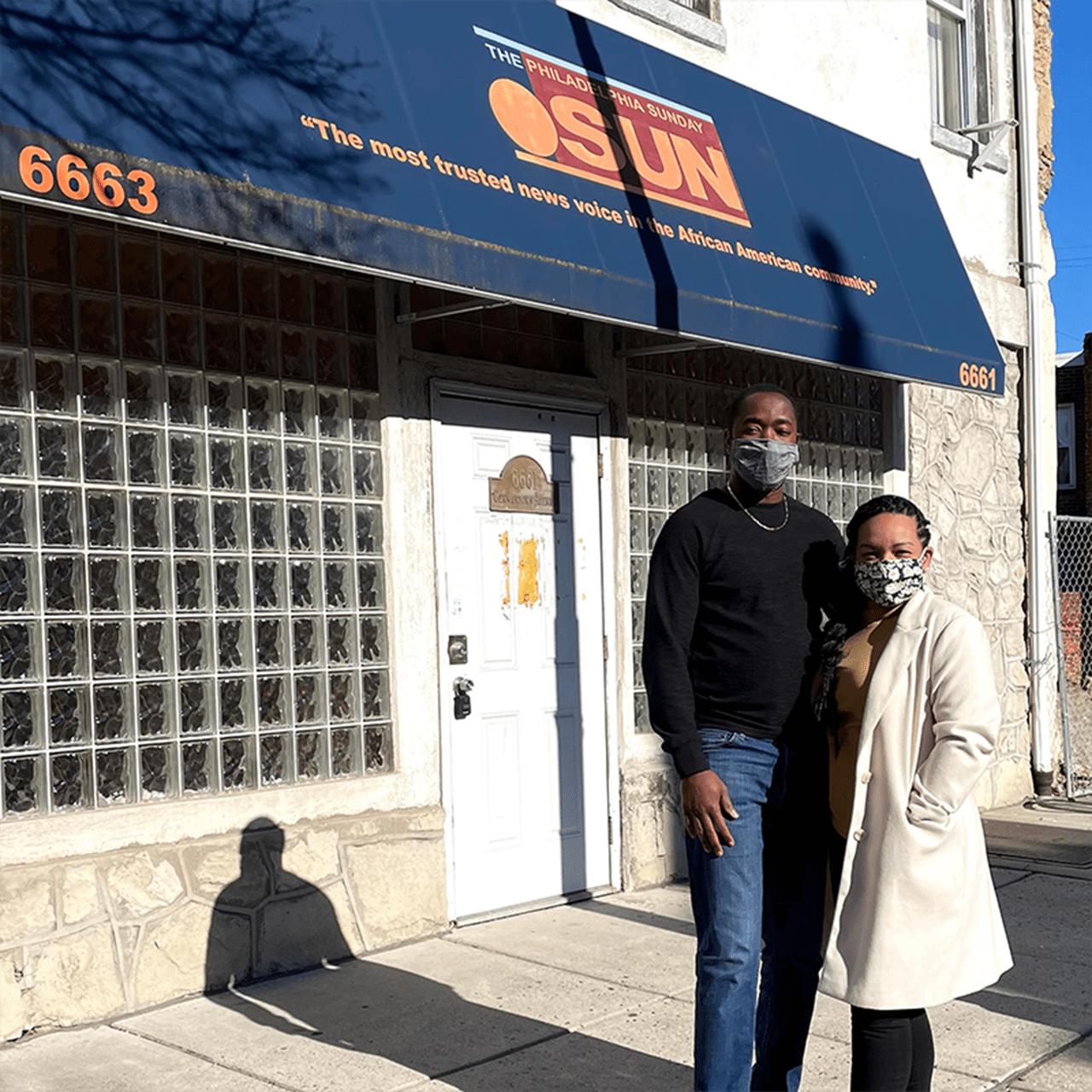 Samantha Rivera Joseph and her husband, Antoine Joseph, pose outside of the Sun Building.