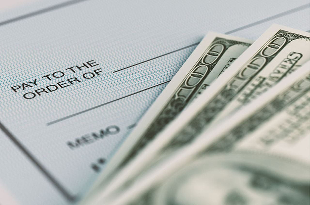 check with three 100 dollar bills