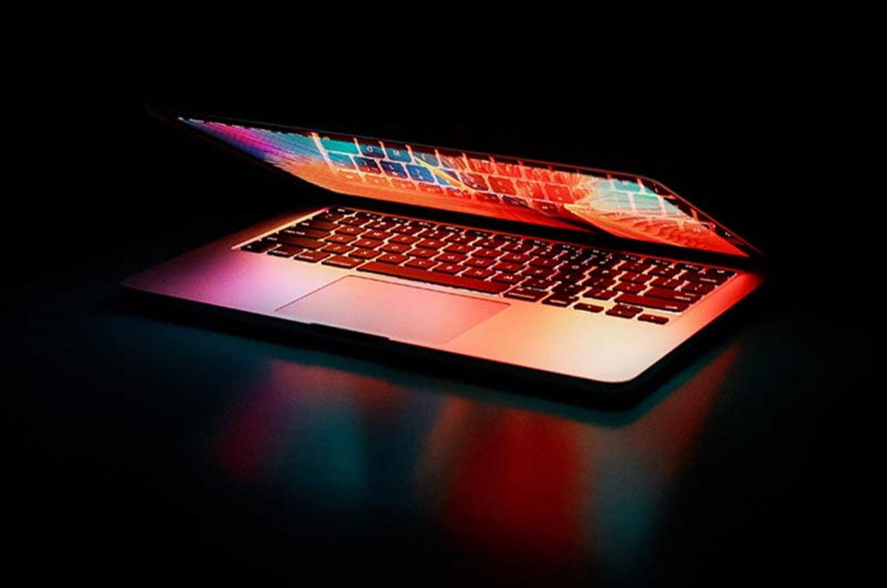 Semi-opened Laptop Computer Turned-on on Table.