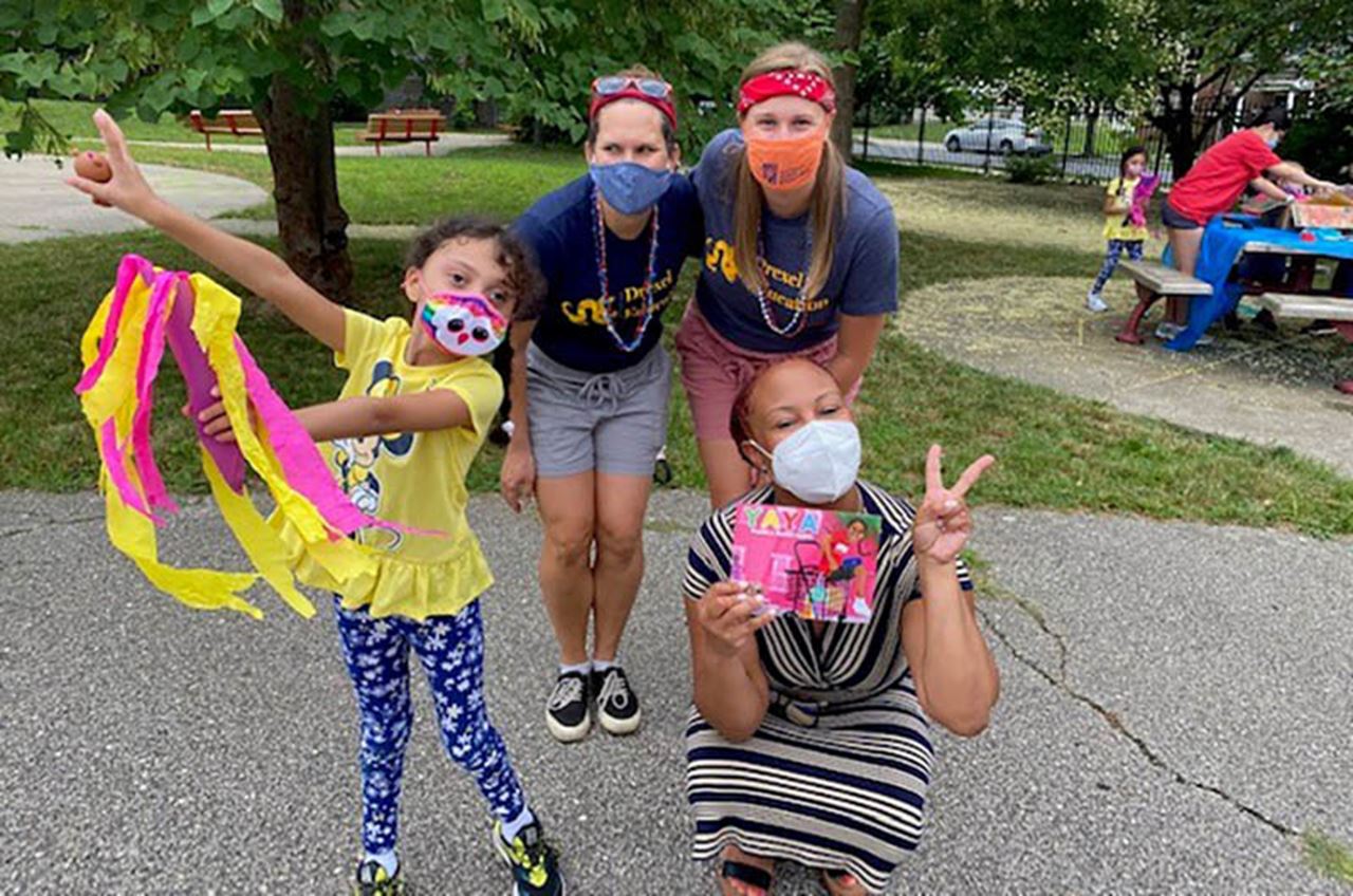 Andrea DiMola and Cory Johnson (standing from left to right) with a student and a visitor from the William Penn Foundation. Photo courtesy Maria Walker. 