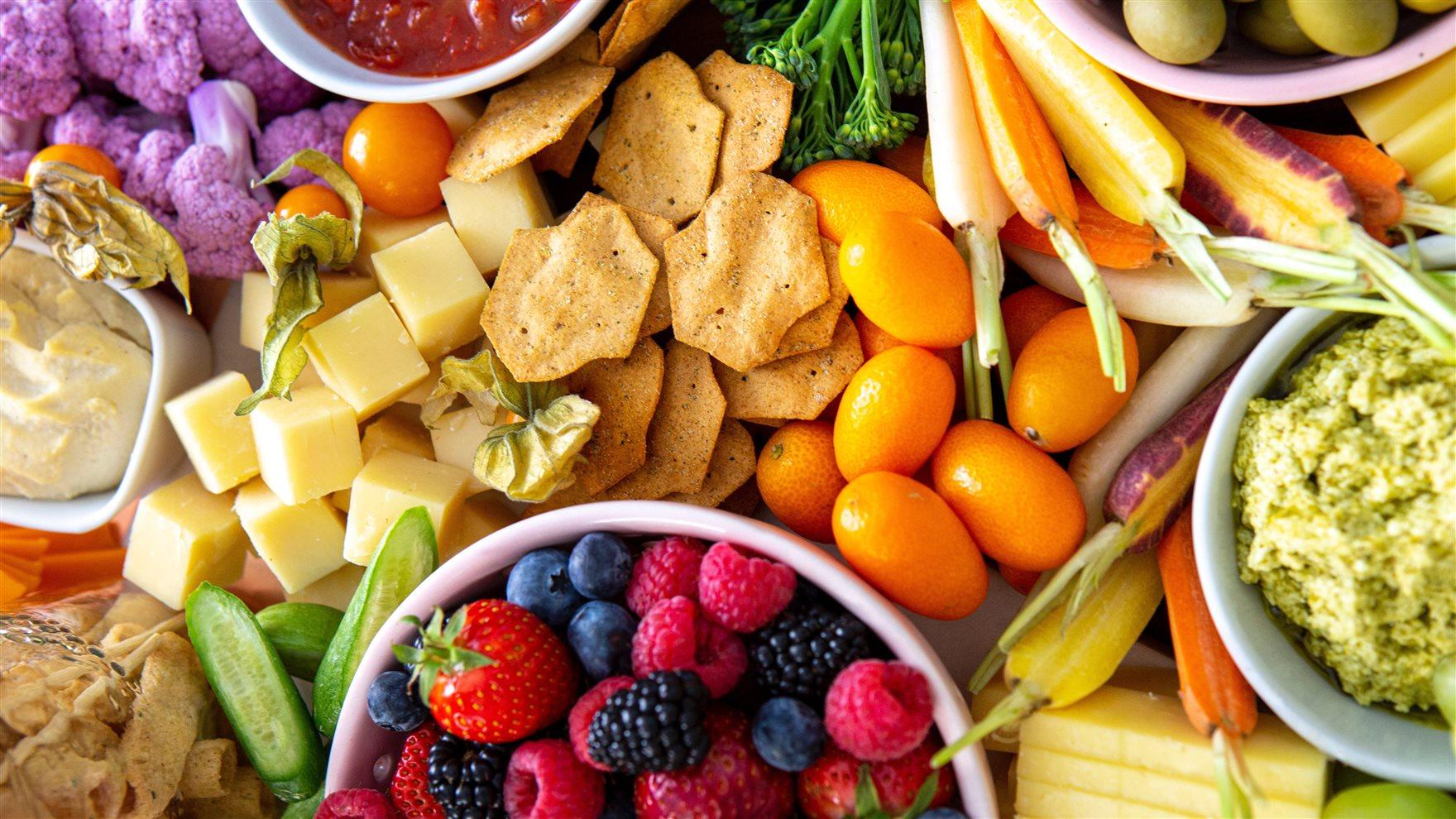 Charcuterie Board with cheese and vegetables and fruit. 