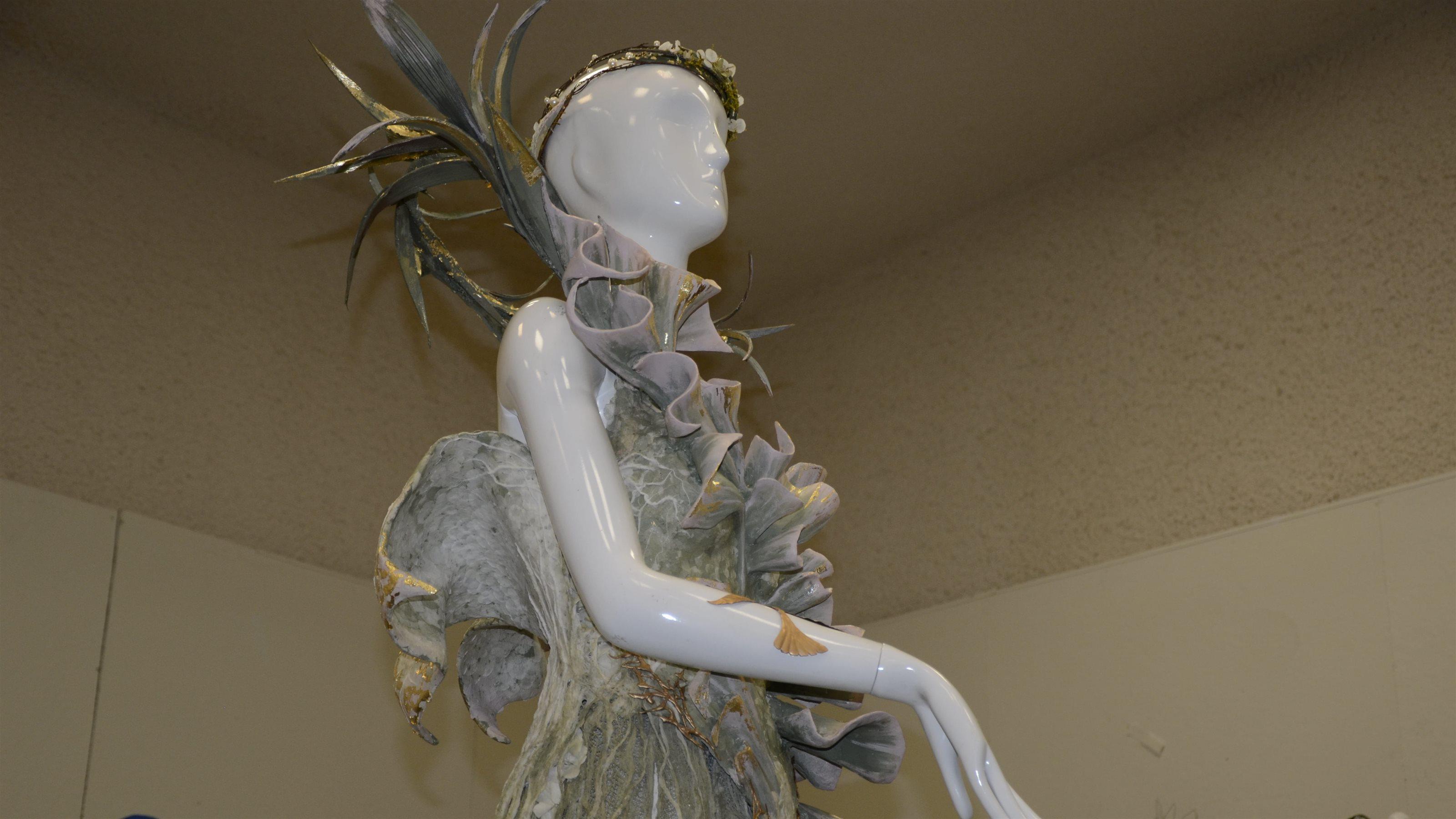 The green dress as shown from the waist up