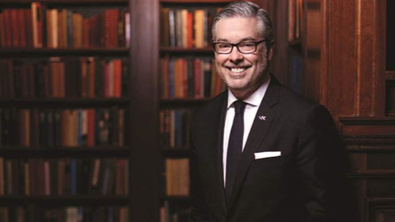 president Fry in front of book library