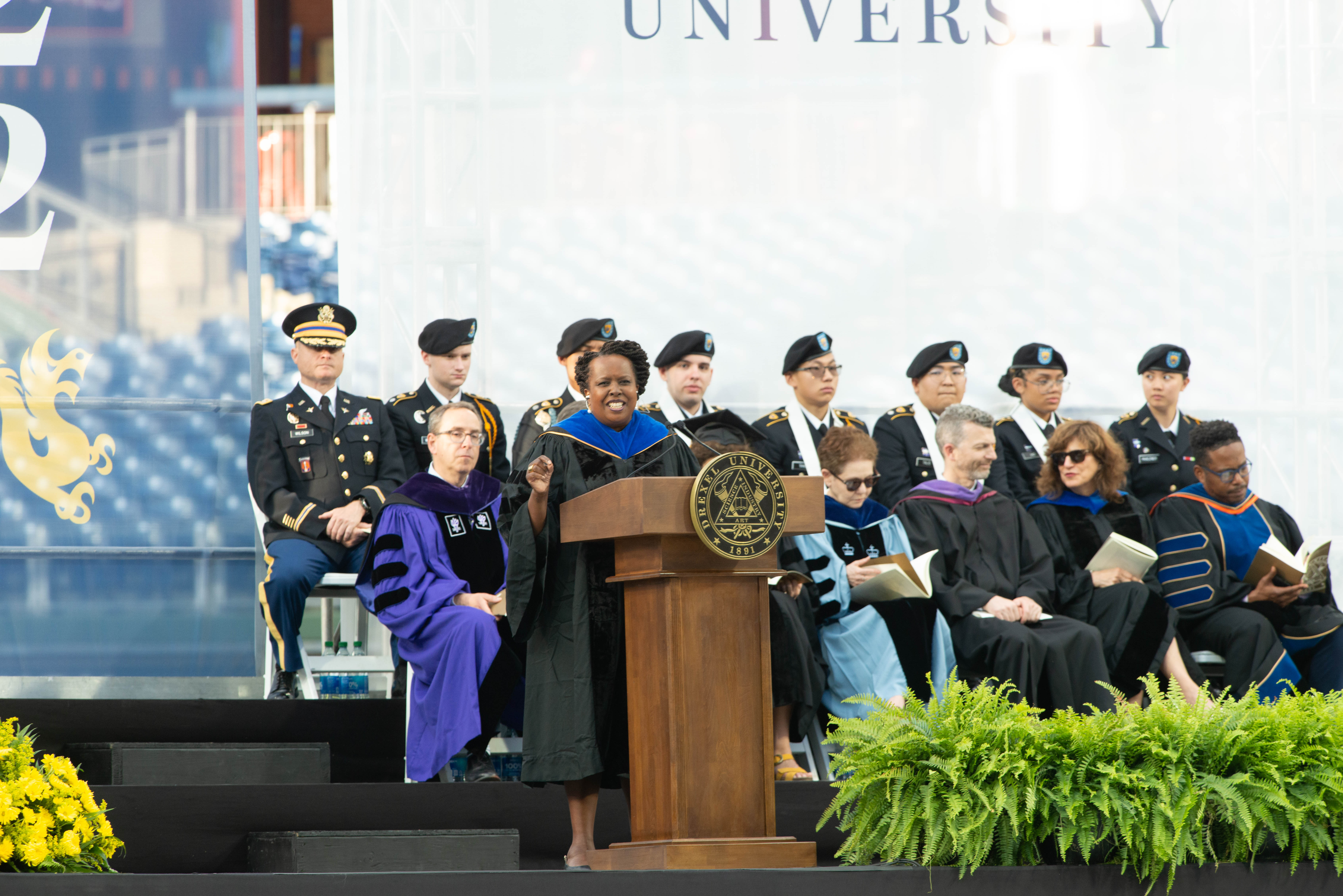 Evelyn Thimba speaks at the podium at Drexel's 2022 Commencement.