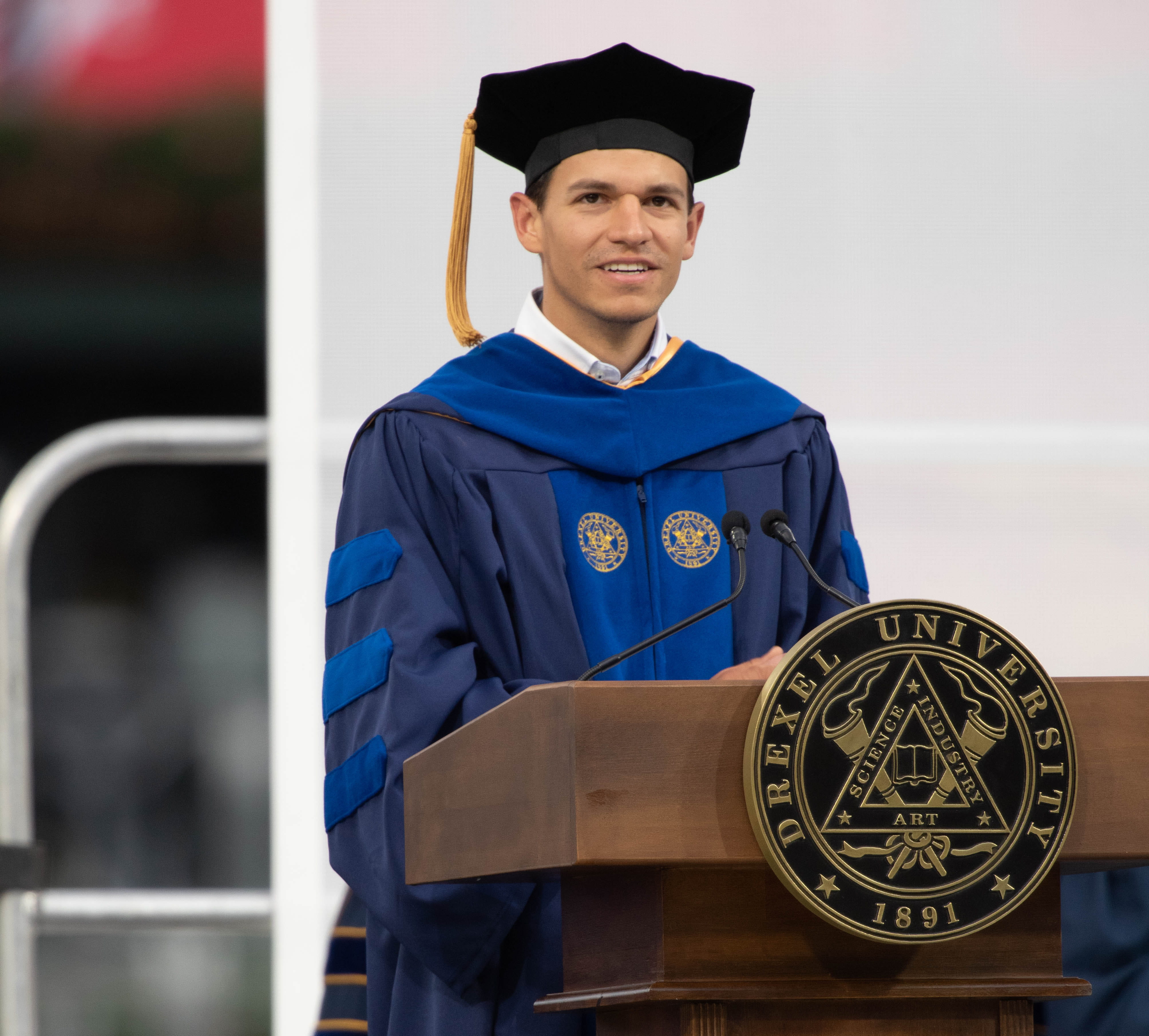 Luis Rebollar Tercero, PhD chemical and biological engineering ‘22, at the podium at Drexel's 2022 Commencement. Photo credit: Kelly & Massa Photography. 