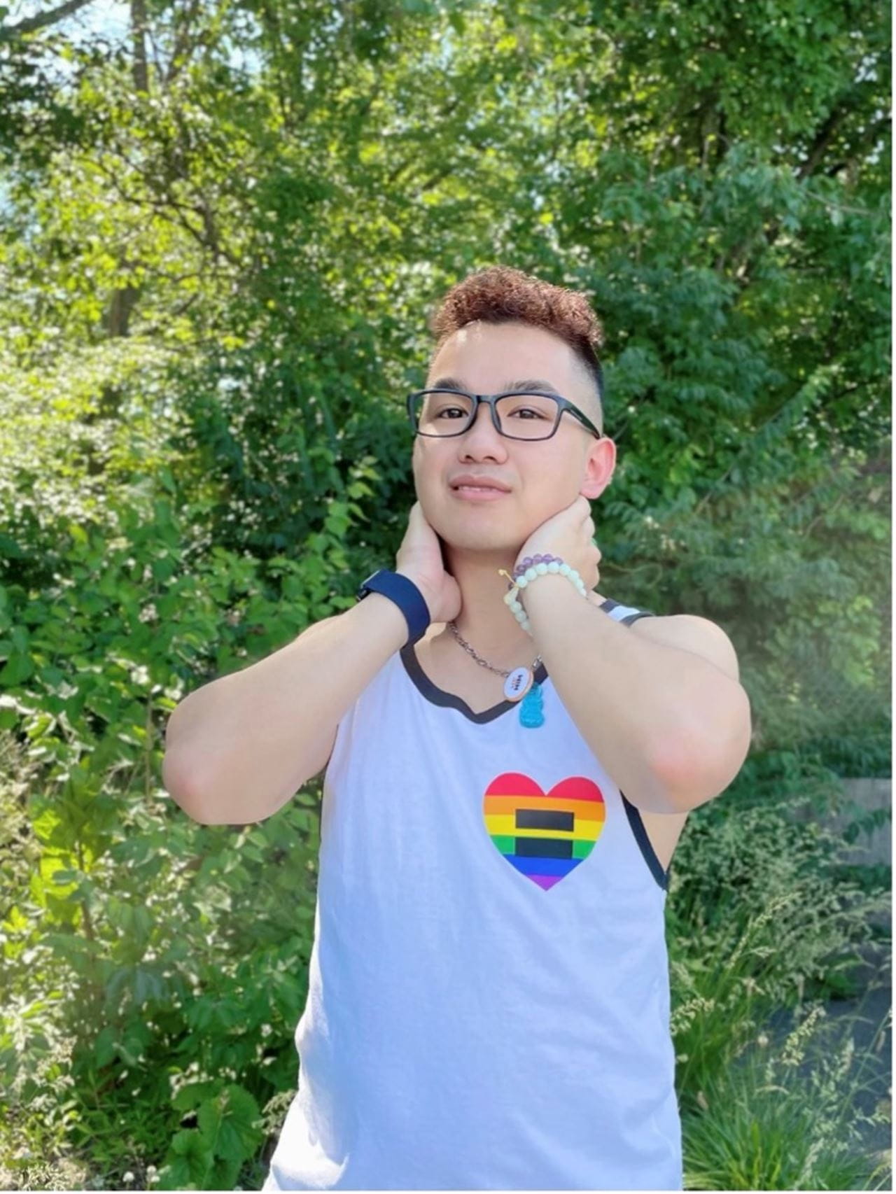 Student wears pride heart tank top.