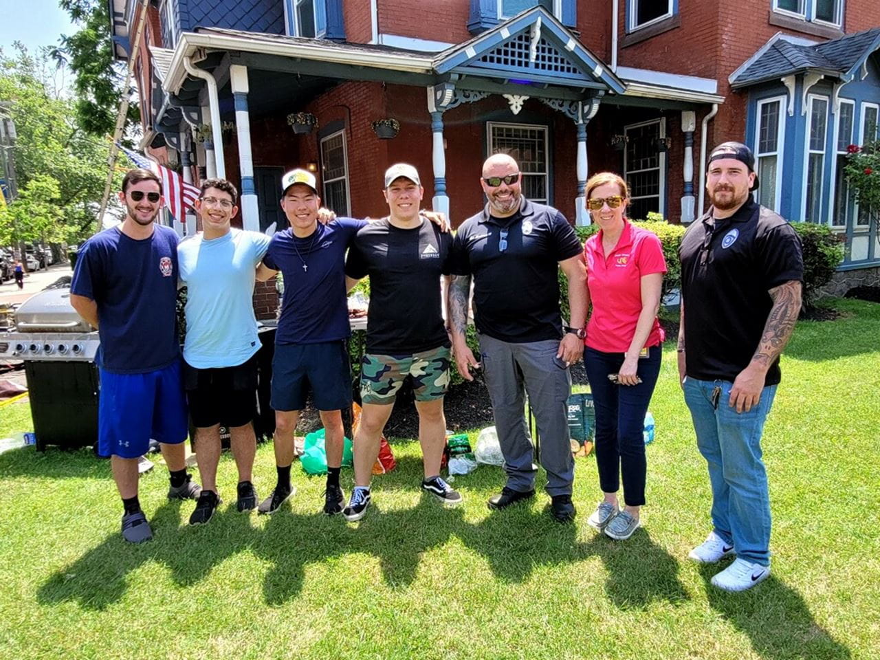 Members of Public Safety and Sigma Alphia Mu outside.