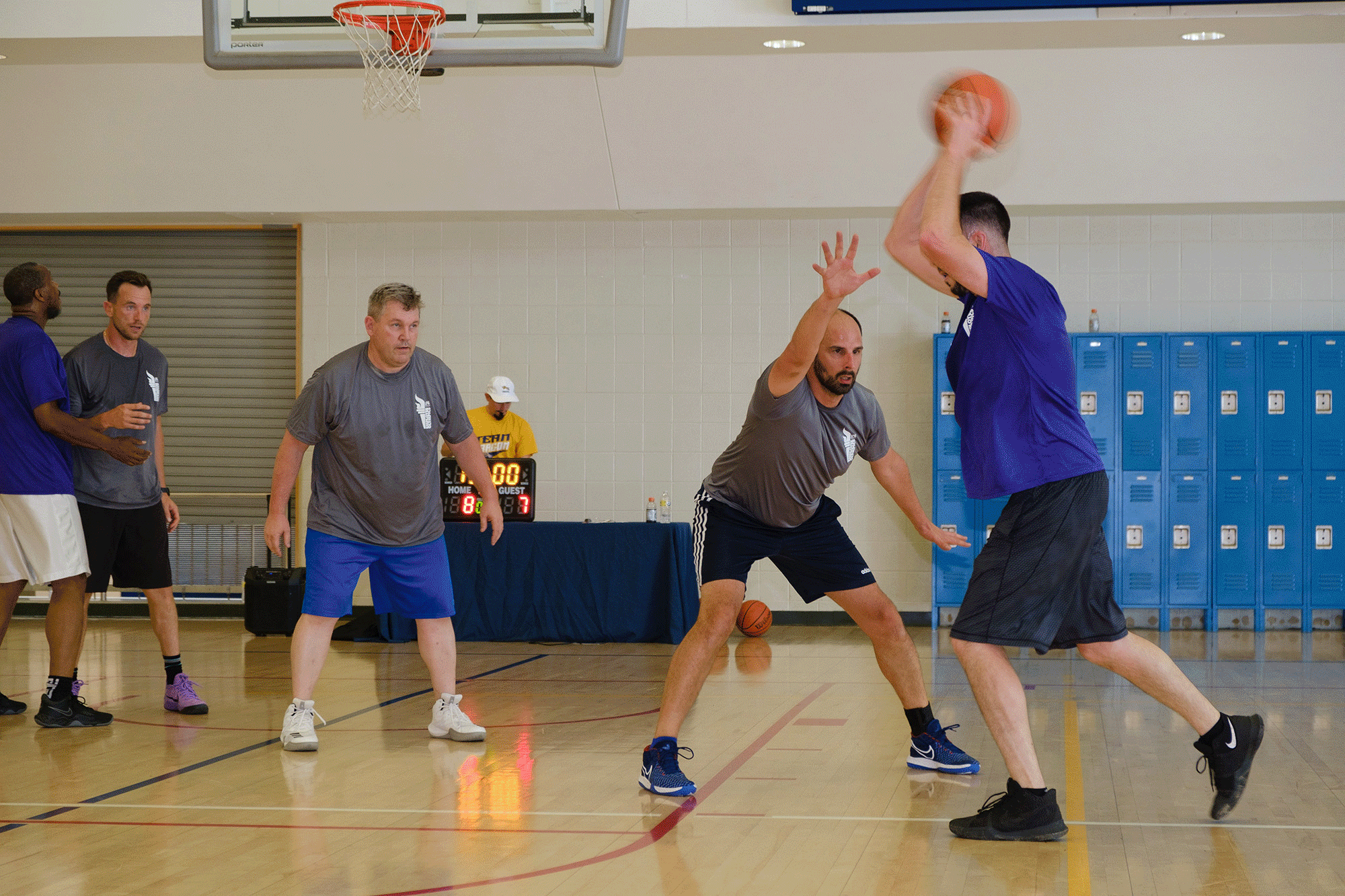 A gif of employees playing basketball, baggo, dodgeball, beach volleyball, and gathering before a walk. 
