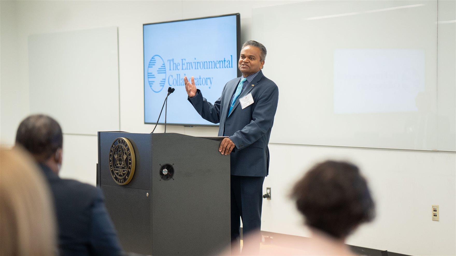 Mathy Vathanaraj Stanislaus speaking from a podium at the opening of The Environmental Collaboratory on Feb. 11, 2022.