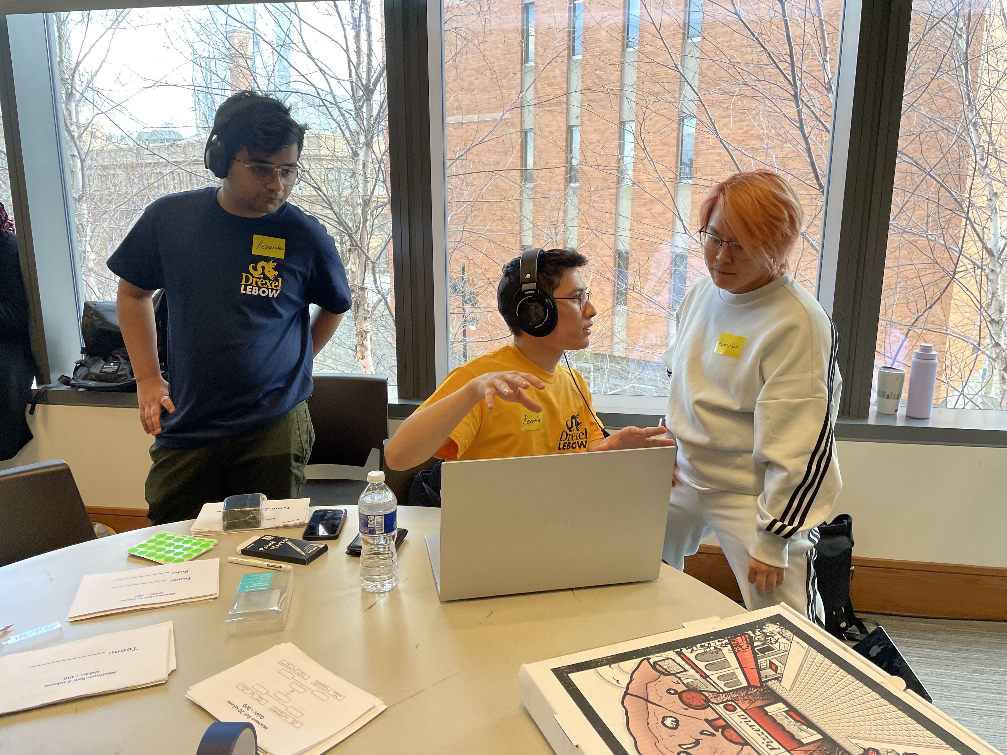 Abhishek Kumar, Brendan Phillips, and Hongjun Ye managing the players online via Discord and Overwatch platforms. Photo credit: Madison Miller.