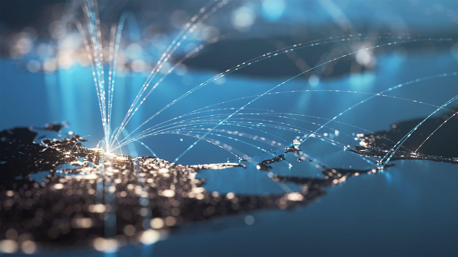 Blue map of the Americas with glowing connection lines between international airports. 
