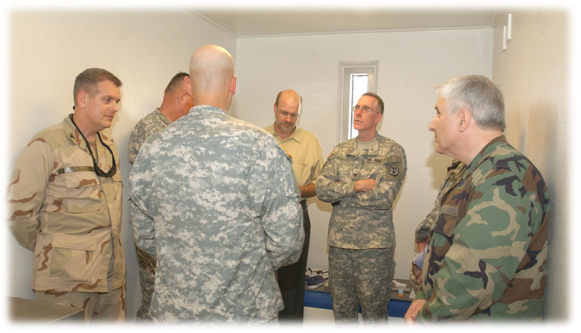 Eric Zillmer photographed visiting a detention center in Guantanamo Bay, Cuba, in 2006 with U.S. military leaders. U.S. Navy photo by: MC3 Remus Borisov; UNCLASSIFIED//Cleared For Public Release; CDR Robert T. Durand, JTF-GTMO PAO.