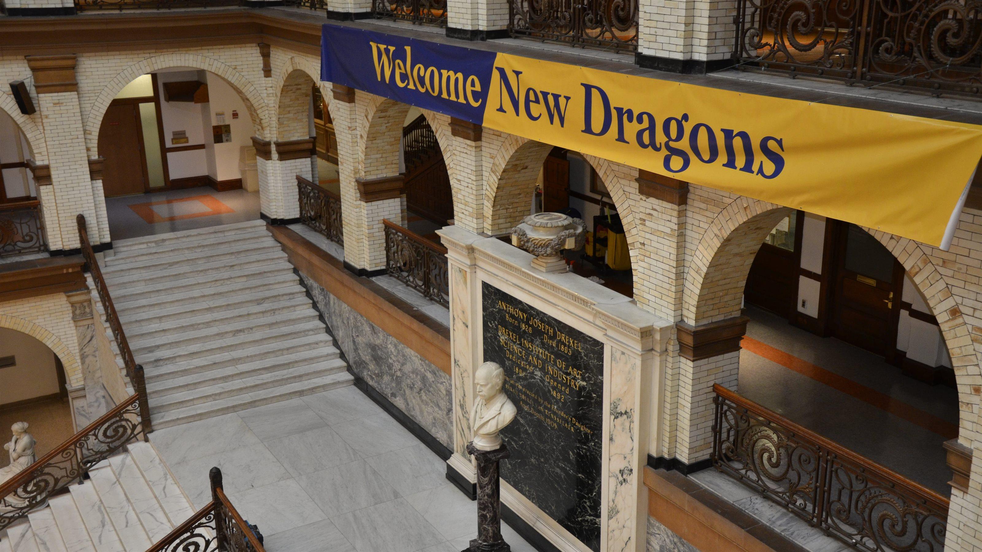 A banner within Main Building reads &quot;Welcome New Dragons&quot; 