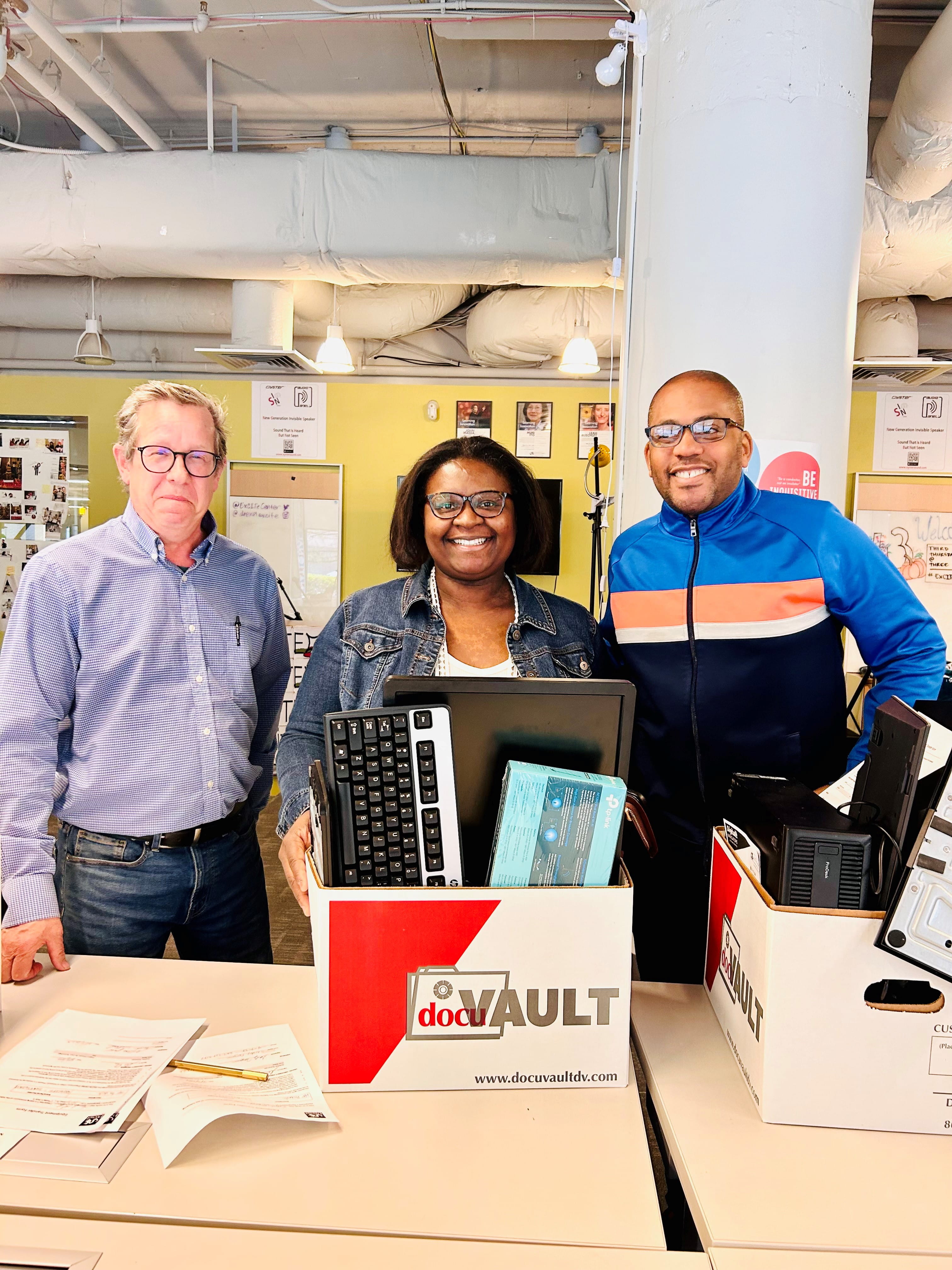 Drexel AP & Procurement Service’s Bo Solomon (left) and Allen Riddick (right) pose with giveaway winner, WBEC member Sandy Ferguson