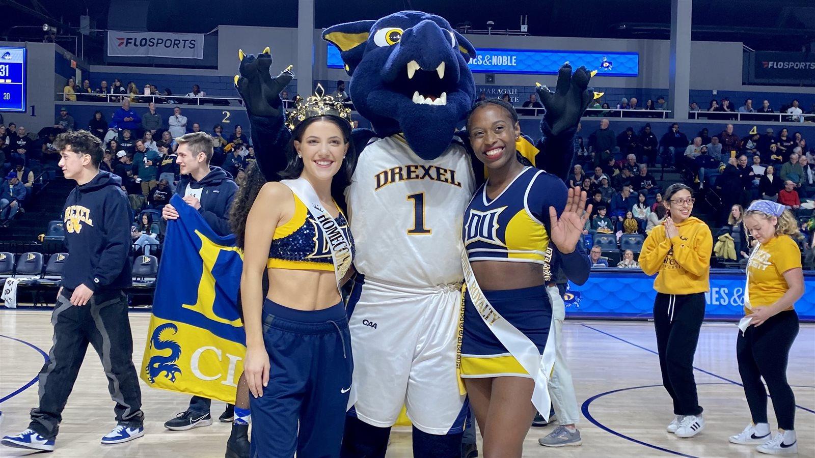 Mario poses with the Royal Dragon and another member of Homecoming Court.