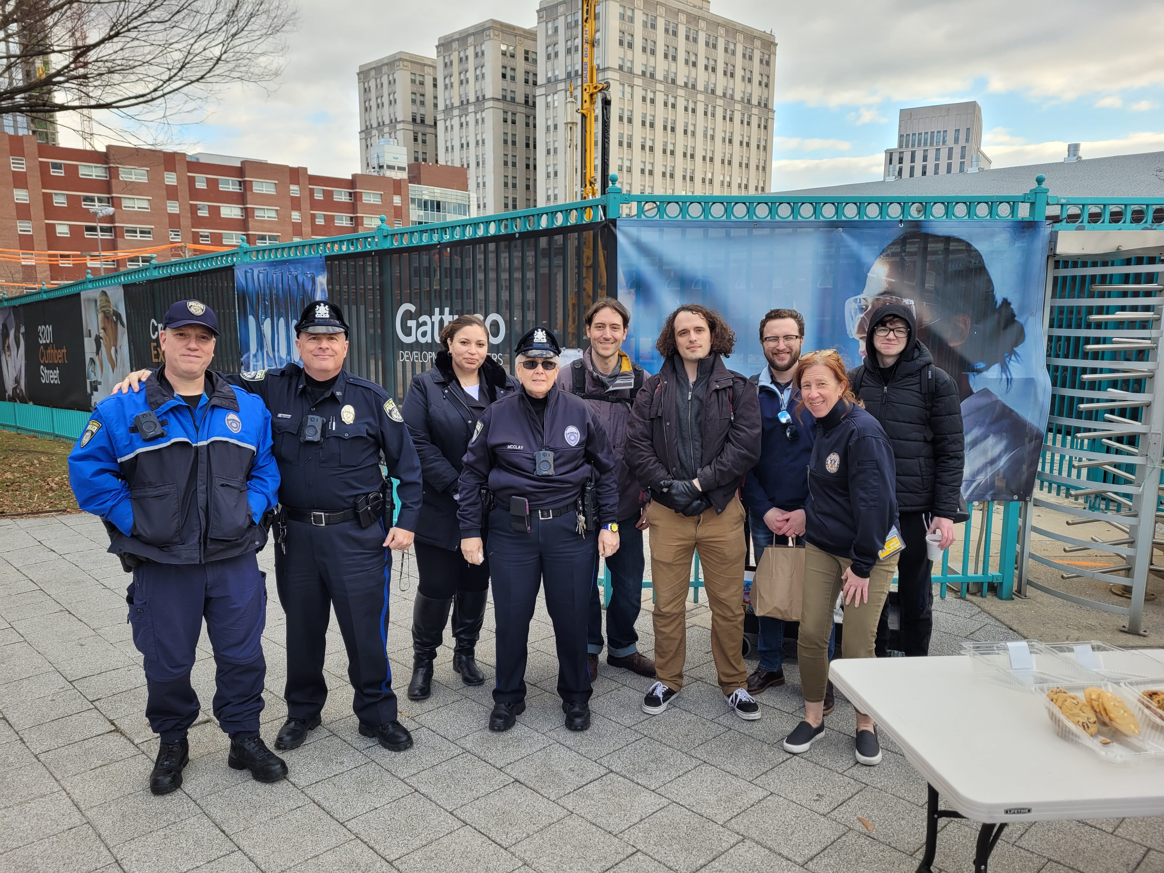 Drexel Public Safety personnel and students pose outside in front of Buckley Field.