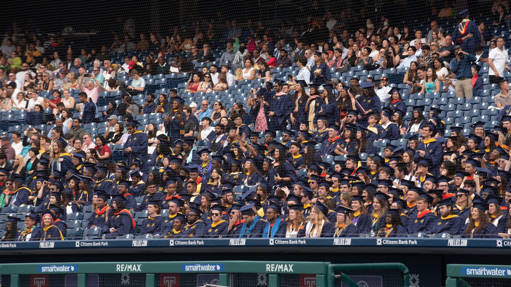 Students in the stands at Citizens bank Park for Commencement