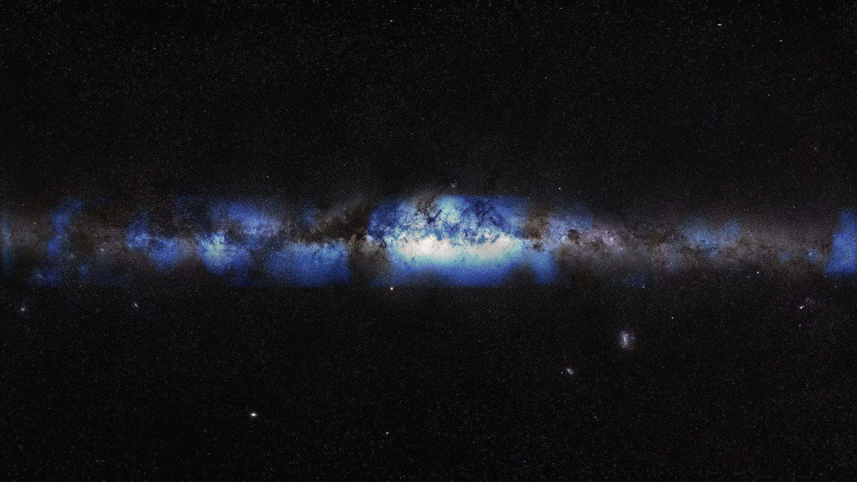 Black sky with stripe of blue and white dust in the middle representing the Milky Way Galaxy