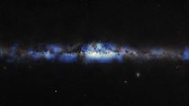 Black sky with stripe of blue and white dust in the middle representing the Milky Way Galaxy