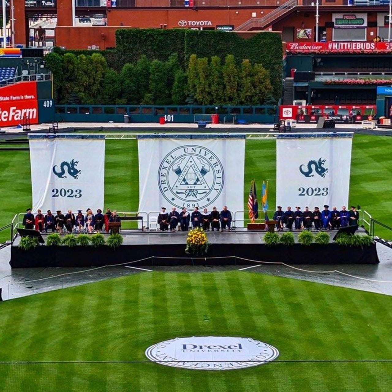 An aerial shot of the people on the stage at Commencement. 