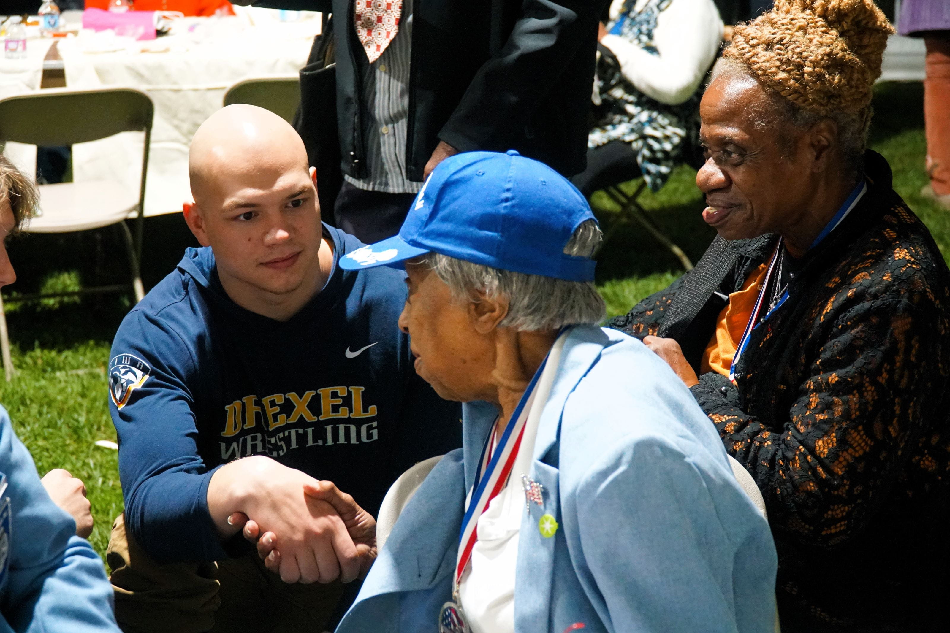 Alma Bailey talks to a member of Drexel Wrestling