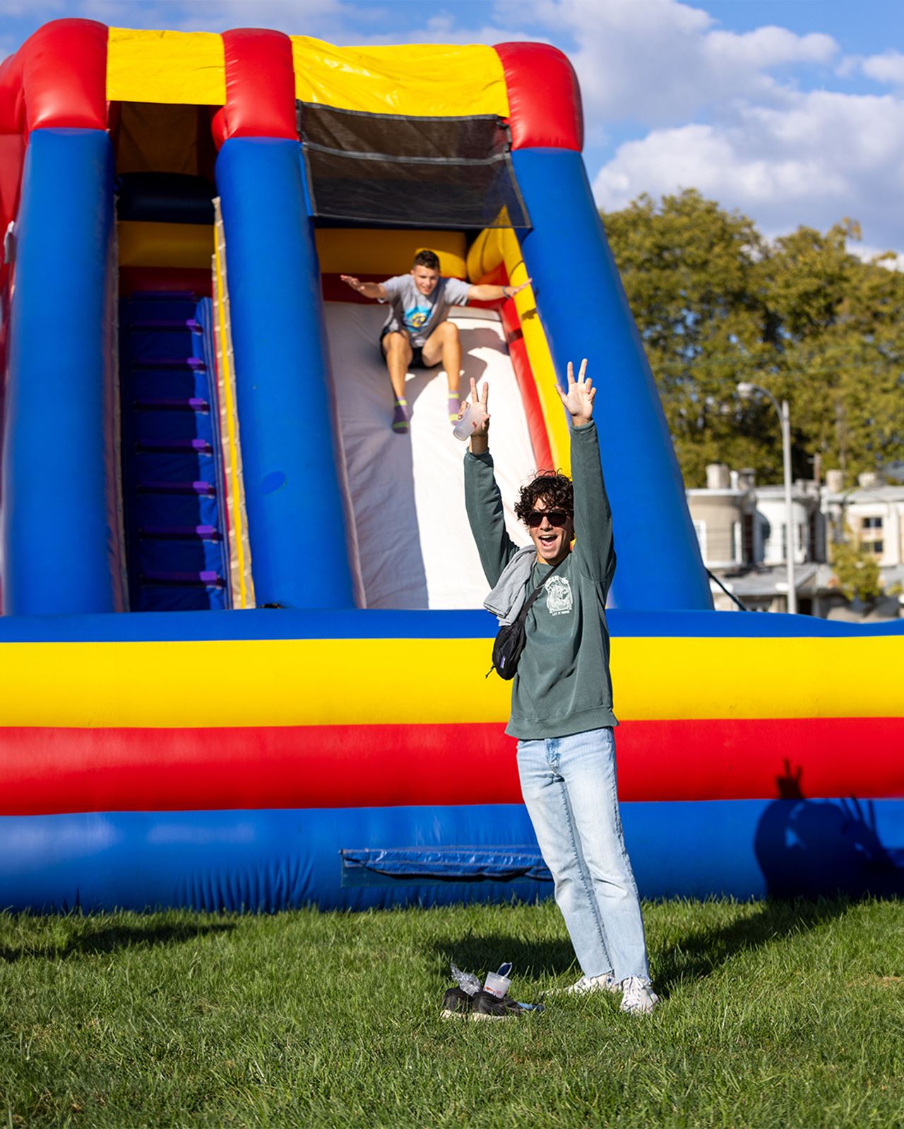 Students go down an inflatable slide