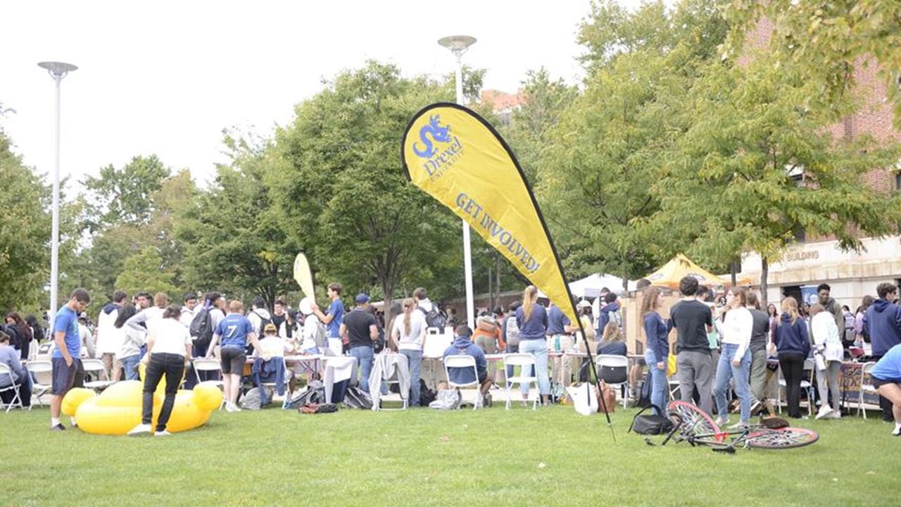 Banner reading Get Involved on Lancaster Walk with involvement fair in background