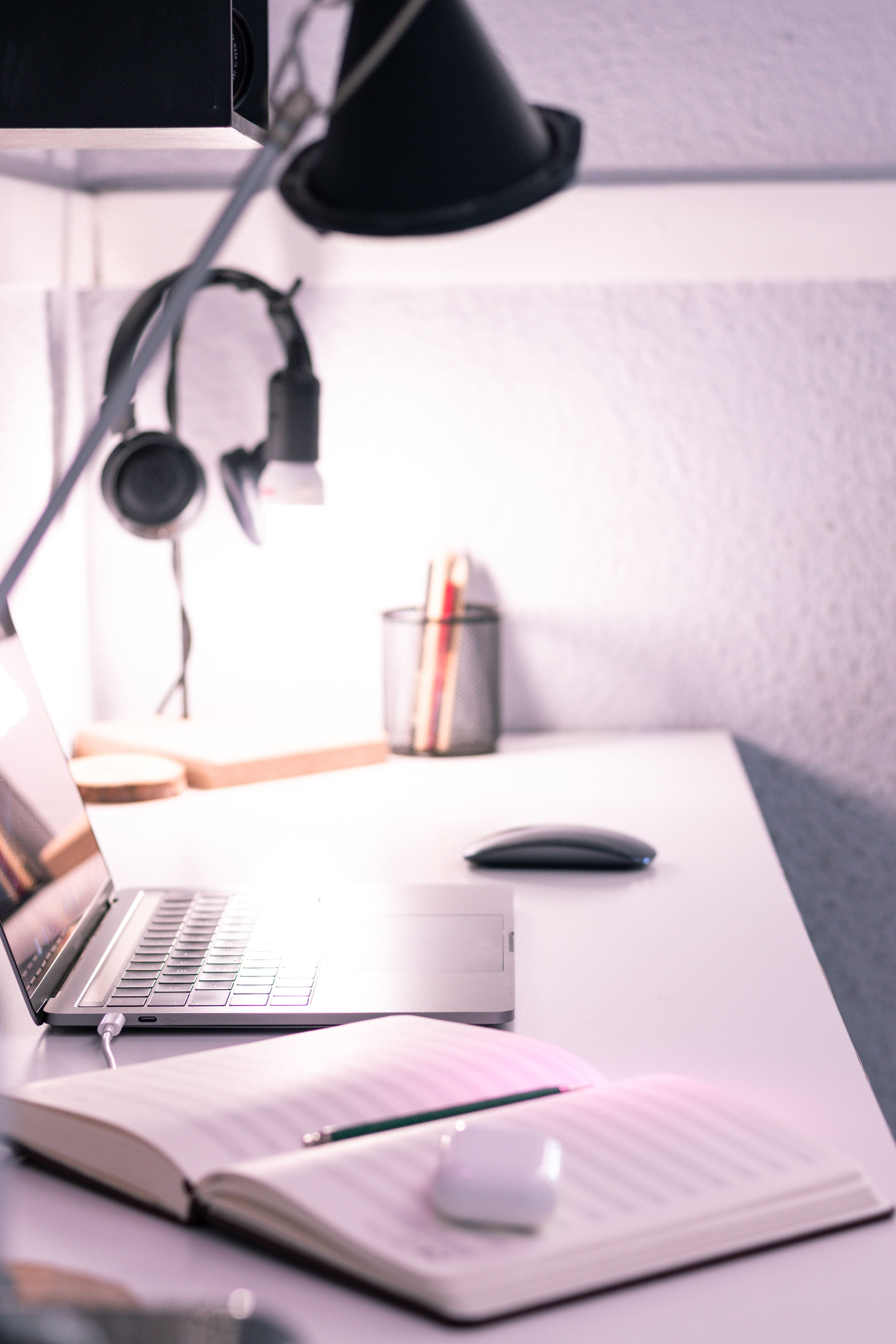 Study setup on a desk with a laptop and notebook