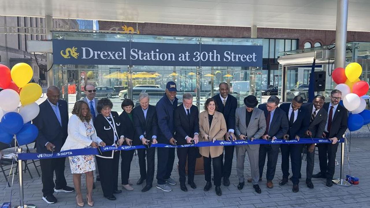 People cutting the ribbon at the Drexel Station at 30th Street.