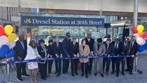 People cutting the ribbon at the Drexel Station at 30th Street.