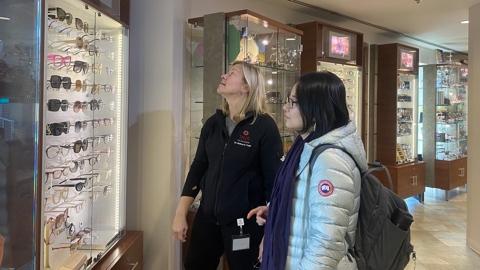 Melissa Trego, left, and June He visited the optical area at Salus’ The Eye Institute in November 2023. Photo credit: Khue Dao. 