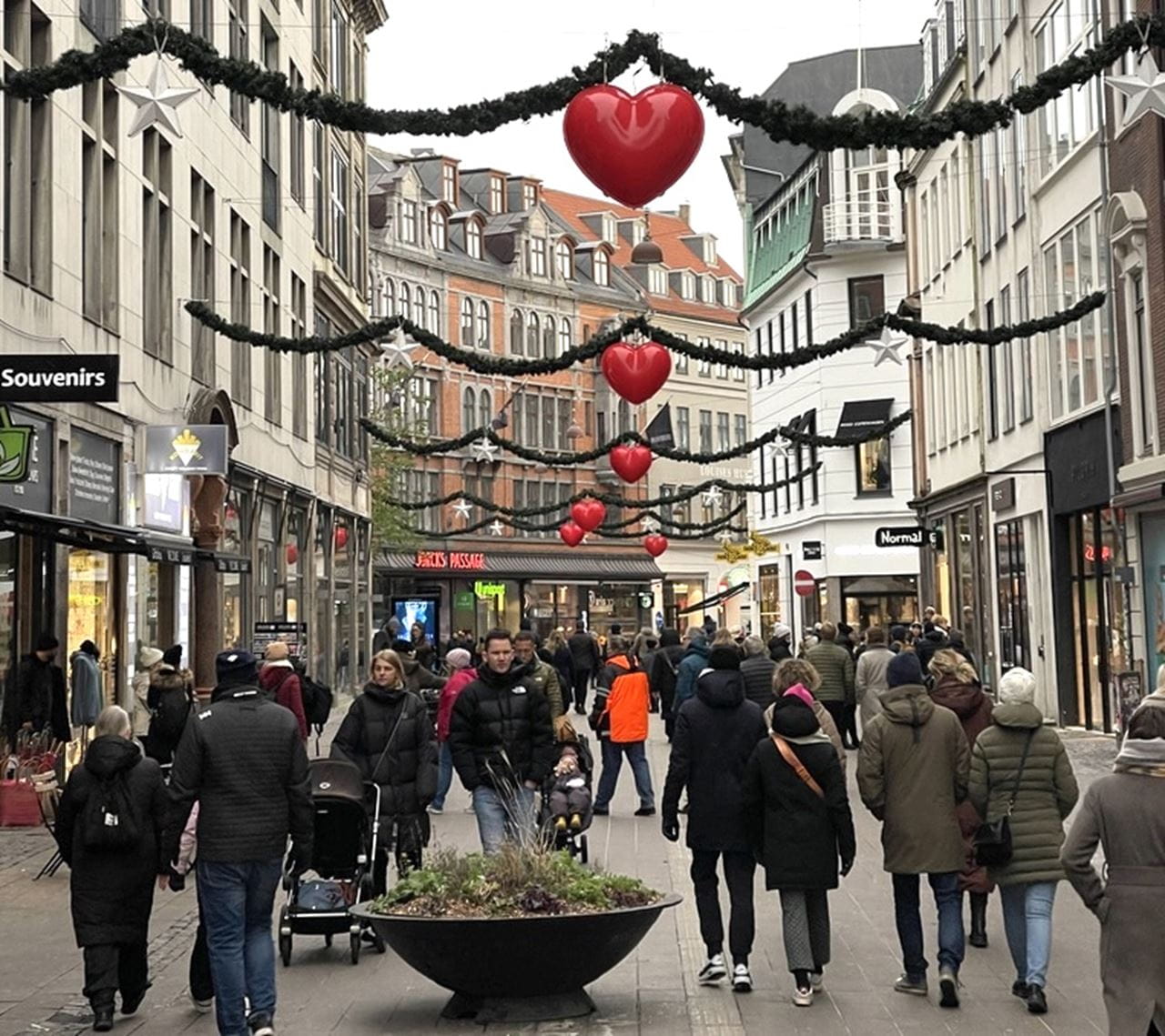 People walking in the decorated streets of Copenhagen.