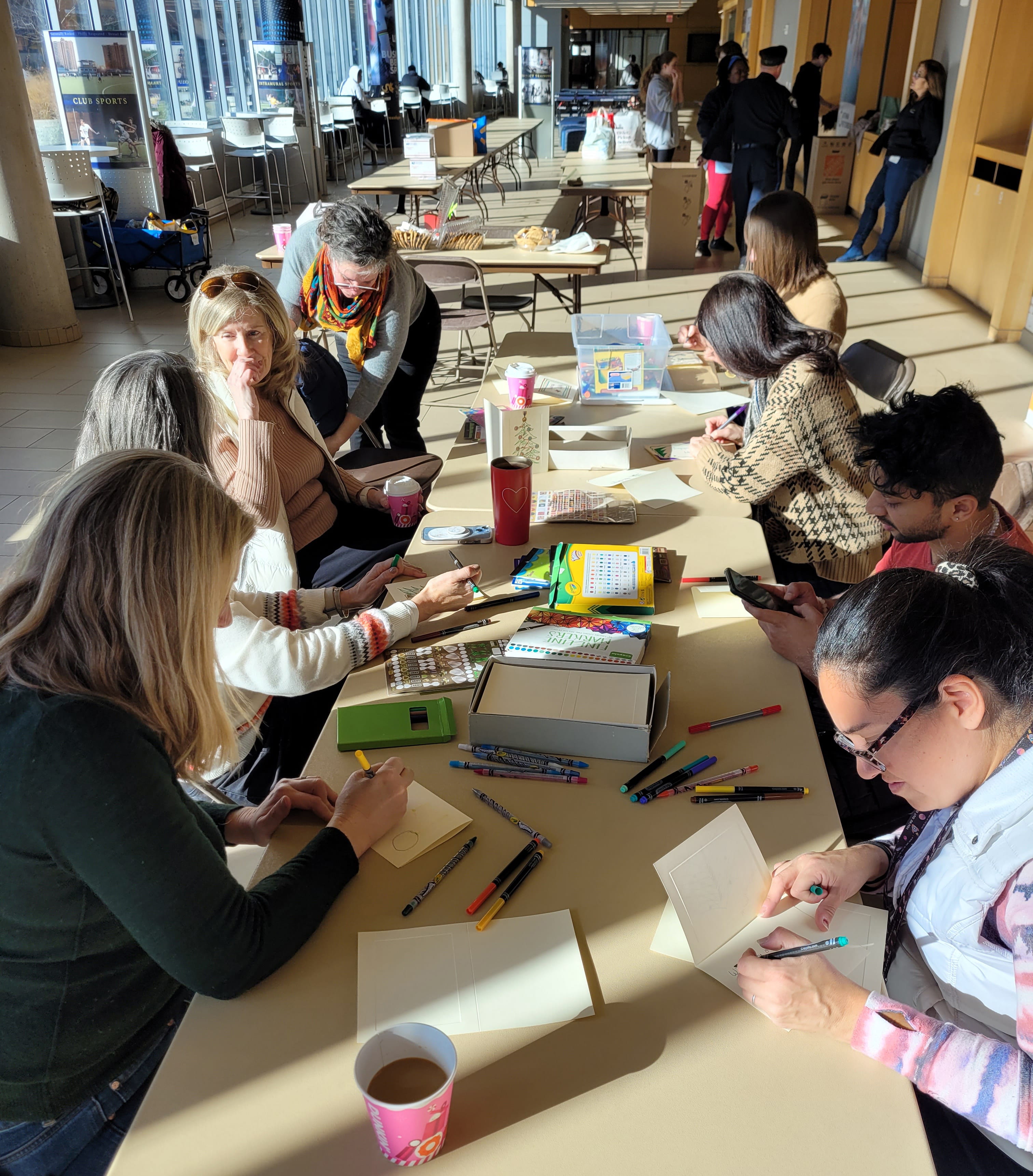 People filling out cards at a table.