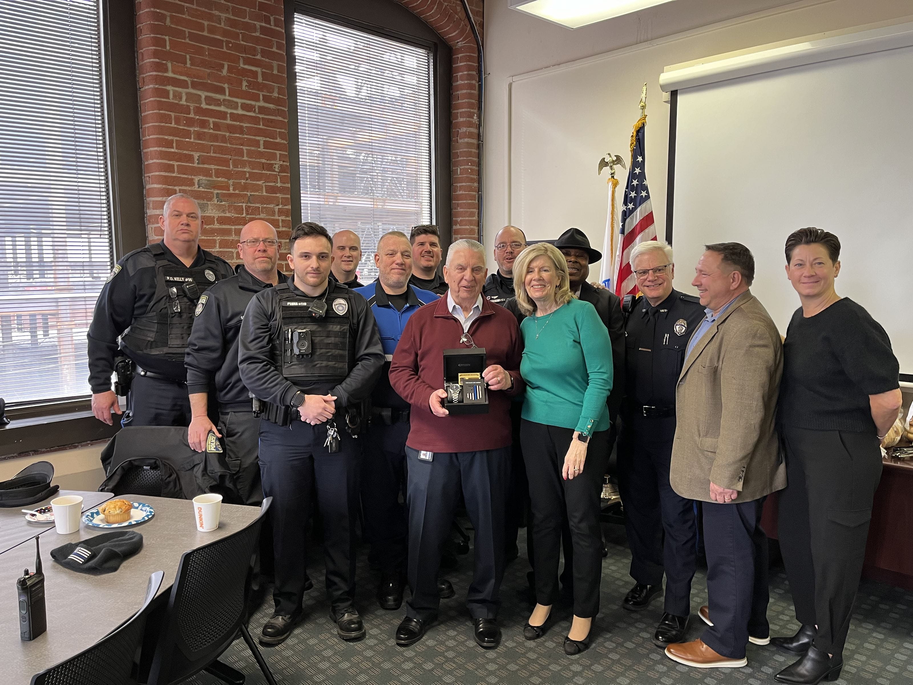 Agroup of people lined up around Bob Lis