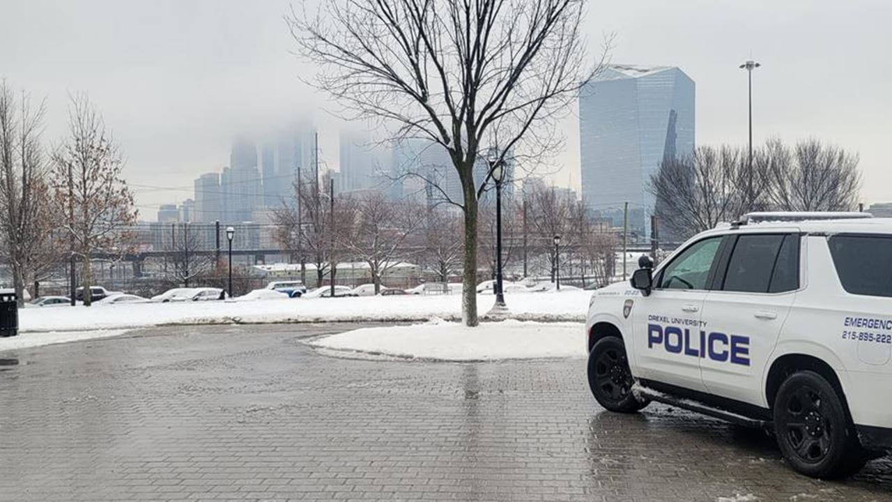 Drexel police care near the snow in Drexel Park.