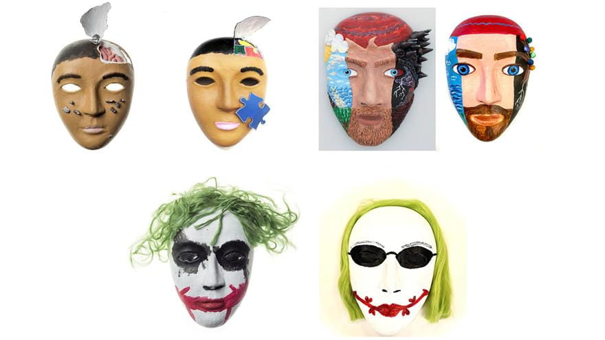 Three pairs of masks, with one decorated with distressing imagery and the other decorated neutrally