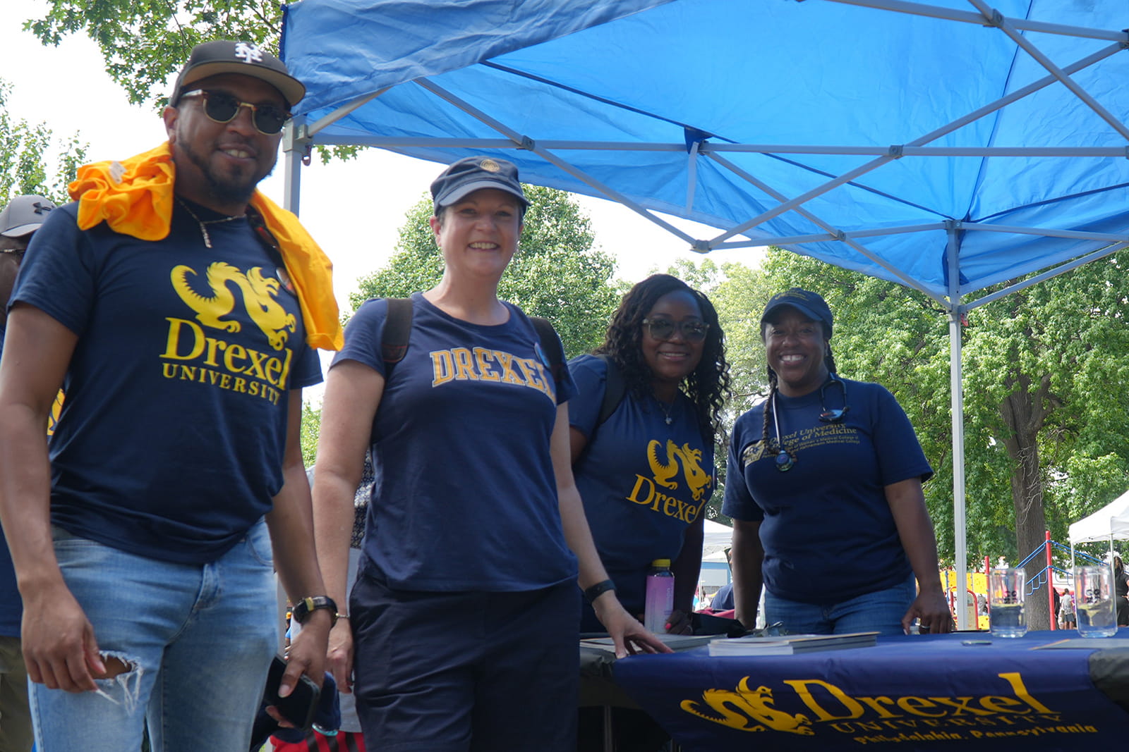 A group of people at a Drexel booth at Philadelphia's Juneteenth parade.