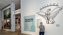 Drexel student and ‘Philadelphia Revealed’ gallery attendant Bailey Michalak standing near the front of the exhibition. 