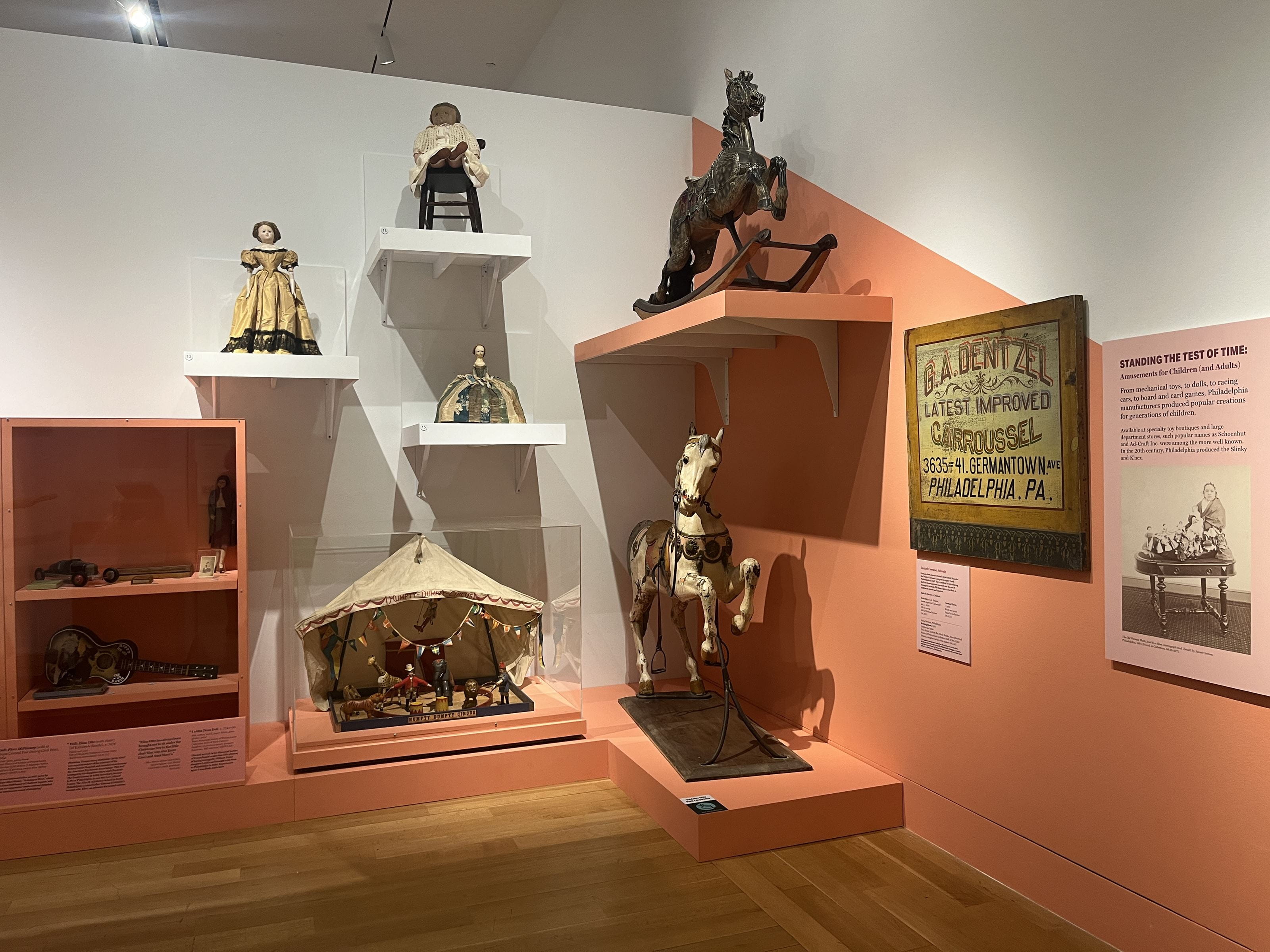 The Eliza Otto doll is seated in the chair (top shelf) in the exhibition.