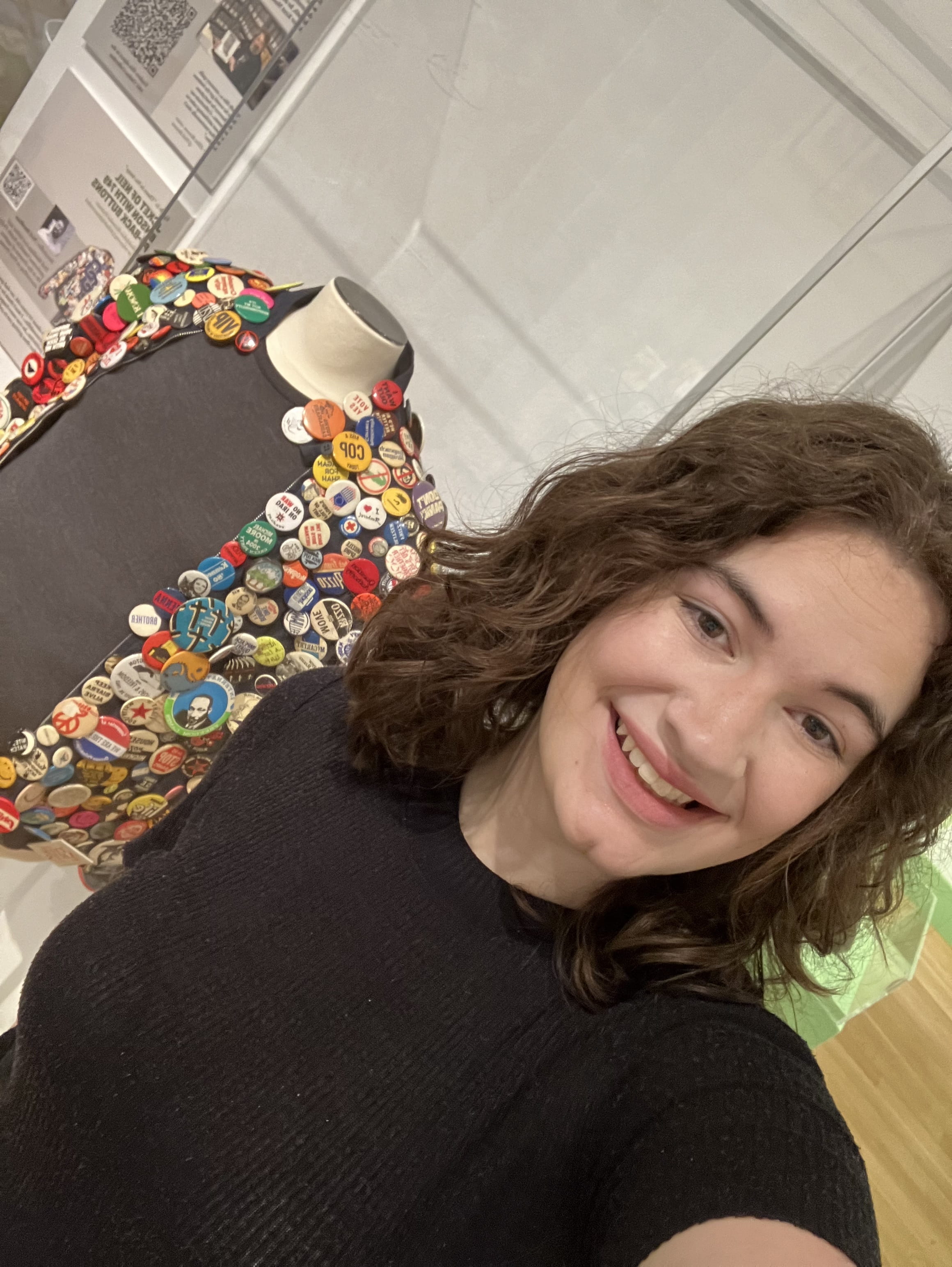 Drexel student and 'Philadelphia Revealed' gallery attendant Emma Johnson posing with the Neil Benson jacket. Photo credit: Emma Johnson.