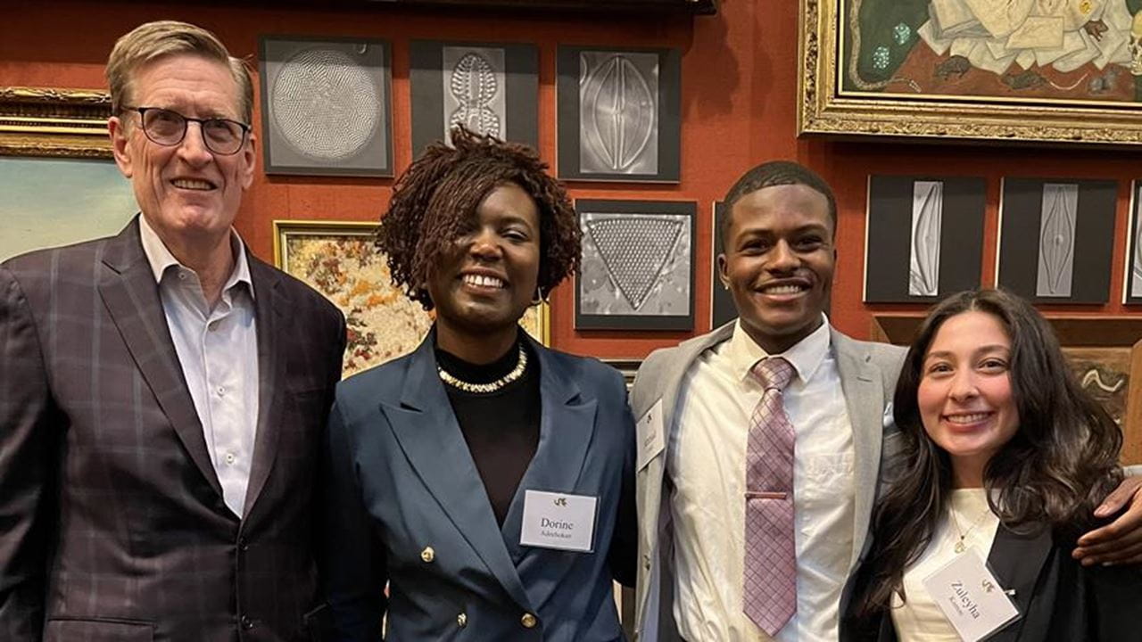Photographed at the Celebration of Scholarship event, from left to right: Drexel University Interim President Denis O’Brien; Dorine Adechokan, finance ’25; Ahmad Curtis, second-year finance student; and Zuleyha Kumas, finance and business law ’25. Photo credit: Kelsey McKee. 