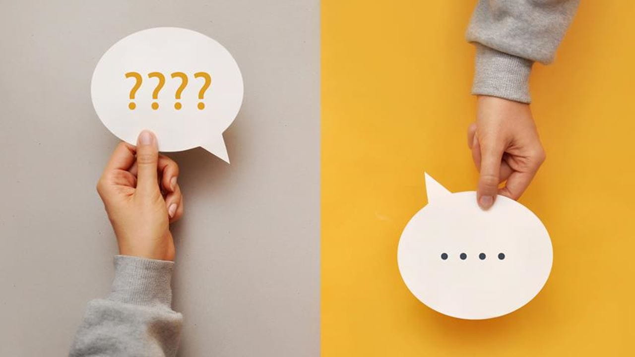 Two hands, each holding a speech bubble in a split screen. One is filled with questions marks and the other is filled with periods.