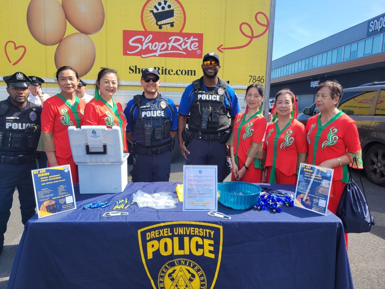DPS officers lined up behind a table outside.