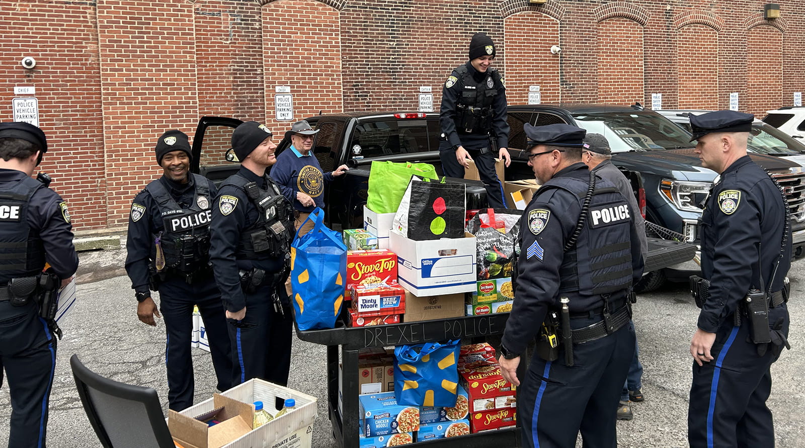 Drexel University Police Department officers helped load the boxes and bags full of donated items to be delivered to Joint Base McGuire-Dix-Lakehurst. Photo credit:   Amy Lutz, police accreditation and training manager in the Department of Public Safety. 