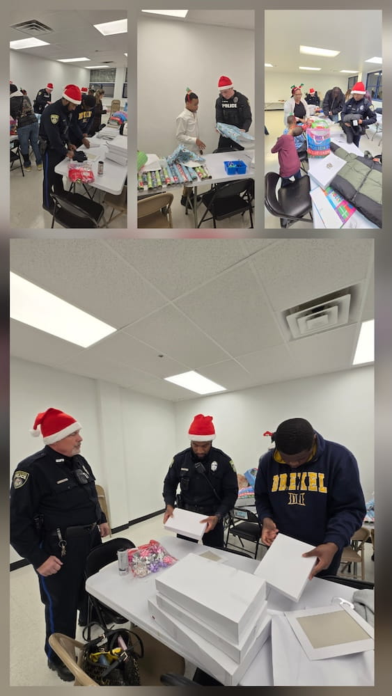 Drexel Police hard at work giving back to the community at a recent holiday event with local families.