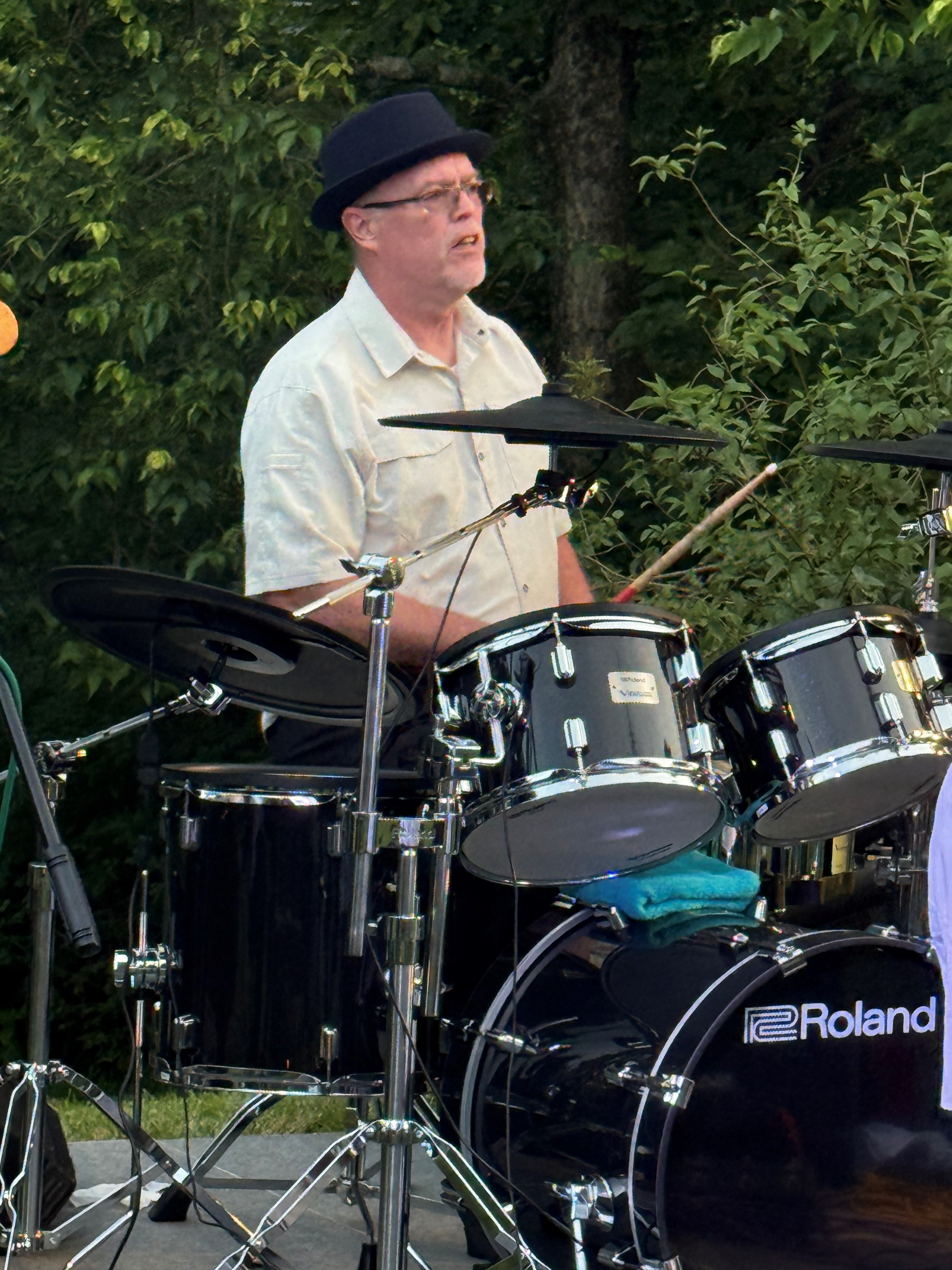Officer Hendricks in action, playing the drums for his cover band, the Groove City Band; check them out at National Night Out on Aug. 5.]