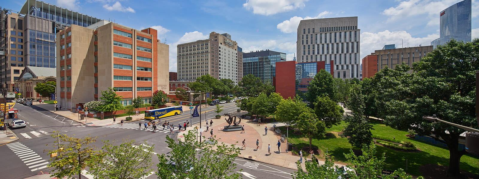 Mario the Magnificent statue and the 33rd and Market Street intersection of Drexel's campus.