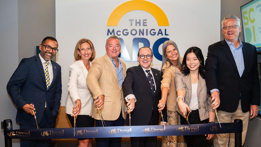 Preparing to cut the ribbon at the ARC